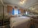 Spacious bedroom with mirrored closet doors and ceiling fan at 650 N Hawes Rd # 5107, Mesa, AZ 85207