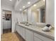 Bathroom with double vanity, granite countertop, and hexagon tile floor at 7500 E Mccormick Pkwy # 11, Scottsdale, AZ 85258