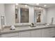 Double vanity bathroom with a large mirror and a walk-in shower at 7500 E Mccormick Pkwy # 11, Scottsdale, AZ 85258