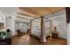 Main bedroom with a four-poster bed, hardwood floors, and wood beam ceiling at 7500 E Mccormick Pkwy # 11, Scottsdale, AZ 85258