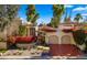 Beautiful home exterior with double garage and lush landscaping at 7500 E Mccormick Pkwy # 11, Scottsdale, AZ 85258