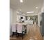 Open kitchen boasts an island, white cabinetry, and stylish hexagon tile flooring at 7500 E Mccormick Pkwy # 11, Scottsdale, AZ 85258