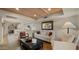 Cozy living room with hardwood floors, a comfortable sofa and access to the kitchen at 7500 E Mccormick Pkwy # 11, Scottsdale, AZ 85258