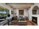 Living room features hardwood floors, fireplace, and wood beam ceiling at 7500 E Mccormick Pkwy # 11, Scottsdale, AZ 85258