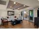 Living area with hardwood floors, access to a patio, and seating area at 7500 E Mccormick Pkwy # 11, Scottsdale, AZ 85258