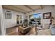 Home office with hardwood floors, built-in desk, and access to a patio at 7500 E Mccormick Pkwy # 11, Scottsdale, AZ 85258