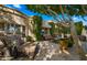 Relaxing patio with seating area, fire pit, and lush landscaping at 7500 E Mccormick Pkwy # 11, Scottsdale, AZ 85258