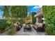 Private patio with seating area and lush landscaping at 7500 E Mccormick Pkwy # 11, Scottsdale, AZ 85258