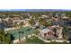 Aerial view of tennis courts and Spanish-style homes at 7500 E Mccormick Pkwy # 11, Scottsdale, AZ 85258