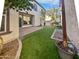 Private backyard with artificial turf and a paved patio area at 10510 E Neville Ave, Mesa, AZ 85209