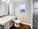 Clean bathroom with white vanity and toilet at 10510 E Neville Ave, Mesa, AZ 85209