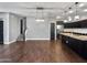 Bright dining room with hardwood floors and modern light fixtures at 10510 E Neville Ave, Mesa, AZ 85209