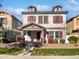Two-story home with red accents and landscaping at 10510 E Neville Ave, Mesa, AZ 85209