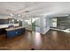 Open kitchen with island and stainless steel appliances at 10510 E Neville Ave, Mesa, AZ 85209