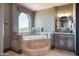 Spa-like bathroom with a soaking tub and stunning views at 10532 N Crestview Dr, Fountain Hills, AZ 85268