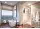 Luxurious bathroom with soaking tub, walk-in shower, and mountain views at 10532 N Crestview Dr, Fountain Hills, AZ 85268