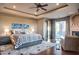 Large bedroom with king bed, fireplace, and access to patio at 10532 N Crestview Dr, Fountain Hills, AZ 85268