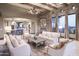 Spacious living room features a stone fireplace and large windows with scenic views at 10532 N Crestview Dr, Fountain Hills, AZ 85268