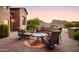 Relaxing patio features comfortable seating, a fire pit, and breathtaking mountain views at 10532 N Crestview Dr, Fountain Hills, AZ 85268