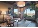 Cozy sitting area with a comfortable sofa and large windows at 10532 N Crestview Dr, Fountain Hills, AZ 85268