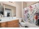 Clean bathroom with a shower/tub combo and wood vanity at 10960 E Monte Ave # 125, Mesa, AZ 85209