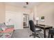 Spacious bedroom with a desk, closet, and bathroom access at 10960 E Monte Ave # 125, Mesa, AZ 85209