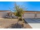 Single-story home with two-car garage and desert landscaping at 10960 E Monte Ave # 125, Mesa, AZ 85209