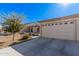 Two-car garage with white door and driveway at 10960 E Monte Ave # 125, Mesa, AZ 85209
