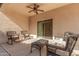 Relaxing patio with wicker furniture and ceiling fan at 10960 E Monte Ave # 125, Mesa, AZ 85209