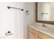 Clean bathroom with single vanity and a framed mirror at 1203 E Muriel Dr, Phoenix, AZ 85022