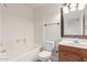Clean bathroom, featuring a shower/tub combo and wood vanity at 1203 E Muriel Dr, Phoenix, AZ 85022