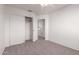 Bright bedroom with carpet flooring and a spacious closet at 1203 E Muriel Dr, Phoenix, AZ 85022
