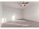 Spacious bedroom with ceiling fan and carpeted floor at 1203 E Muriel Dr, Phoenix, AZ 85022