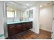 Double vanity bathroom with a teal countertop and tiled shower at 1326 N Central Ave # 416, Phoenix, AZ 85004