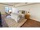 Bright bedroom with a queen bed and wood floors at 1326 N Central Ave # 416, Phoenix, AZ 85004