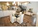 Elegant dining area with a glass table and four white chairs at 1326 N Central Ave # 416, Phoenix, AZ 85004