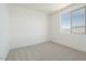 Bright bedroom with carpeted floors and large window at 1350 E Prescott St, Gilbert, AZ 85298