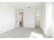 Bright bedroom with carpeted floors, large windows, and closet at 1350 E Prescott St, Gilbert, AZ 85298