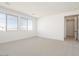 Large bedroom with carpet, multiple windows and an open doorway at 1350 E Prescott St, Gilbert, AZ 85298