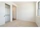Bedroom featuring a closet with a clothes rail, a window and carpeted flooring at 1350 E Prescott St, Gilbert, AZ 85298
