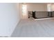 Hallway featuring carpet flooring and a wooden railing at 1350 E Prescott St, Gilbert, AZ 85298