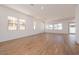 Bright and spacious living room with wood-look tile floors and large windows at 1350 E Prescott St, Gilbert, AZ 85298