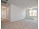 A bright, carpeted living room with recessed lighting and an abundance of natural light at 1350 E Prescott St, Gilbert, AZ 85298