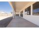 Covered outdoor patio with view of block wall and blue sky at 1350 E Prescott St, Gilbert, AZ 85298