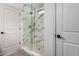 Bathroom with a large walk-in shower and marble tile at 1628 W San Tan Hills Dr, San Tan Valley, AZ 85144
