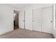 Spacious bedroom with neutral carpeting and access to bathroom at 1628 W San Tan Hills Dr, San Tan Valley, AZ 85144