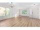 Bright living room featuring hardwood floors, large windows, and a chandelier at 1628 W San Tan Hills Dr, San Tan Valley, AZ 85144