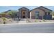 Craftsman style home with stone accents and landscaped front yard at 17417 E Monument Ct, Rio Verde, AZ 85263