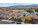 Aerial view showcasing a home's desirable location overlooking a golf course and pond at 26573 W Abraham Ln, Buckeye, AZ 85396