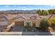 Aerial view of single-story home, showcasing curb appeal and mountain views at 26573 W Abraham Ln, Buckeye, AZ 85396